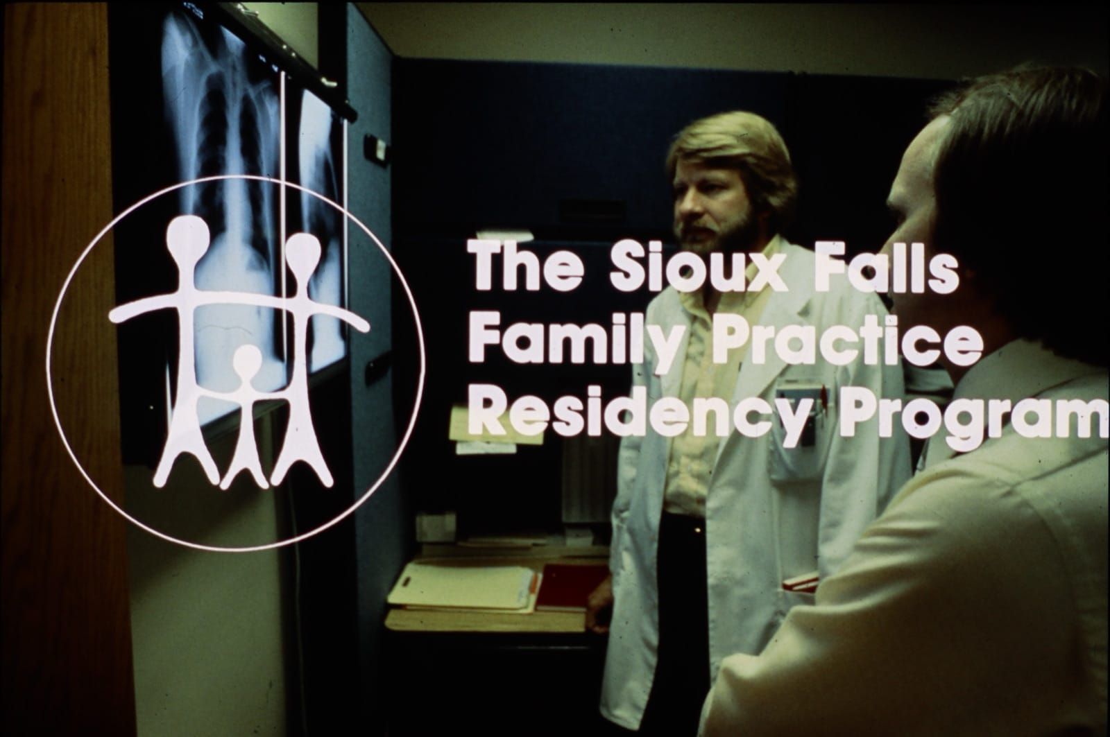 Vintage Pierre Rural Family Practice Residency Program signage with faculty reviewing chest X-rays