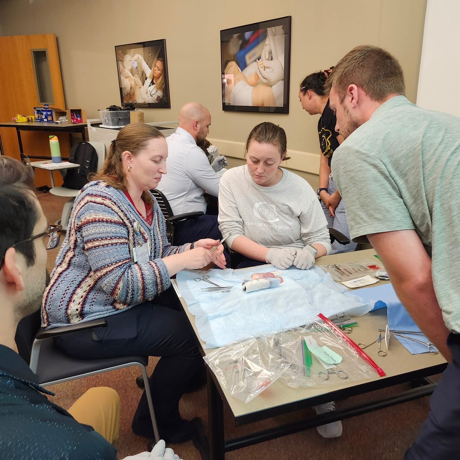 Residents working through a hands-on suturing and skin-procedures workshop at the Center for Family Medicine